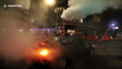 Steam vapour clouds busy Manhattan rush hour streets