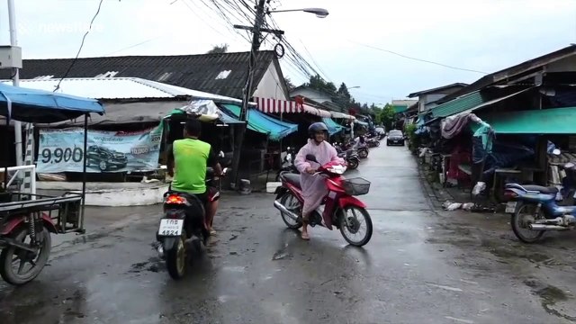 Waves crash on Thai island as locals and tourists brace for Storm Pabuk