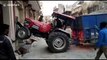 Whoops! Tractor driver gets stuck in between houses