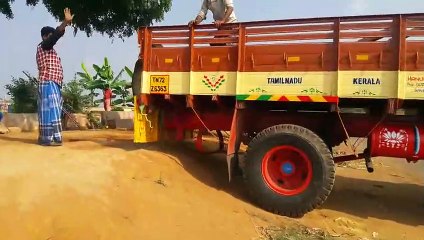 Elephant getting on board truck....