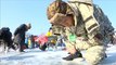 South Korea's ice fishing festival lures locals and foreign tourists