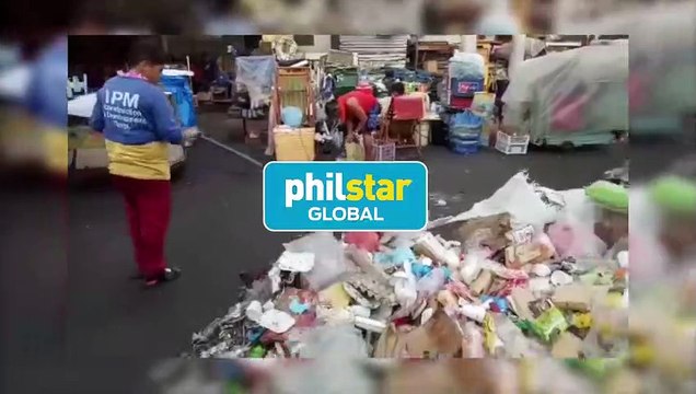 Street sweeper cleans up piles of trash left by Black Nazarene devotees at Quiapo Church