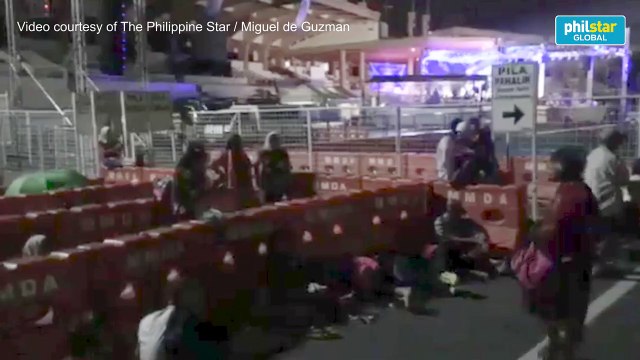 Black Nazarene devotees spend the night waiting in line for the 'pahalik'