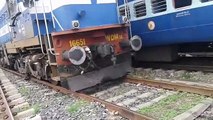 How do they put 2 train carriages together in India - Manually!