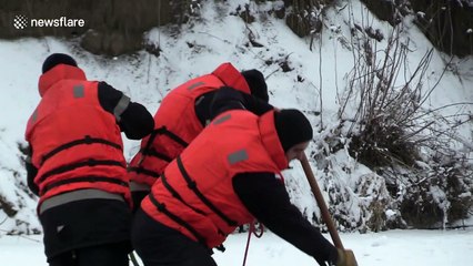 Locals pluck lost dog from icy river in perilous 4hr rescue mission