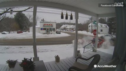 Scary scene as car loses control on snowy road, hits house