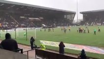 Mansfield Town fans celebrating their 99th minute equaliser at Notts County