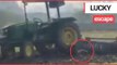 Moment stunt goes wrong when young farmer tries to leap on a moving tractor - but is dragged beneath