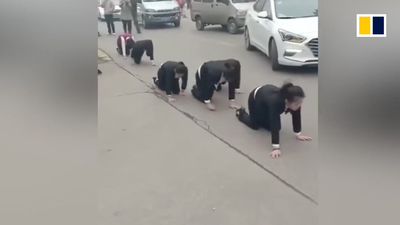 Chinese employees forced to crawl on busy road as punishment