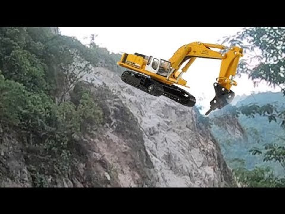 Excavator Works The Mountain And Roadside