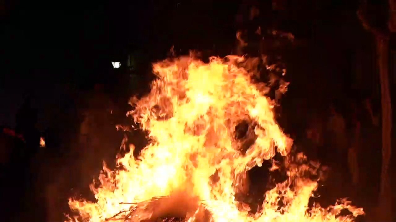 Horses run through bonfires at Luminarias festi...