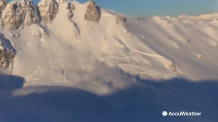 Controlled avalanche barrels down mountainside