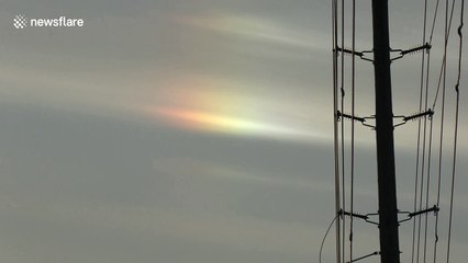 Cold weather in Toronto causes rainbow-like refraction in the sky