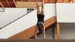 Gymnast Does Press Handstands on Balance Beam