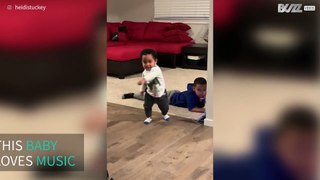 Adorable baby dancing on popular song