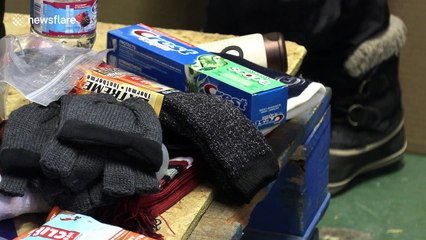 Volunteers in Toronto pack emergency supplies for the homeless during severe cold weather outbreak