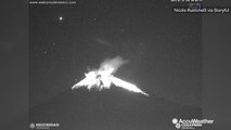 Volcano puts on vibrant display as it erupts in to the night sky
