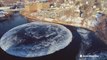 Giant ice disk spins in river