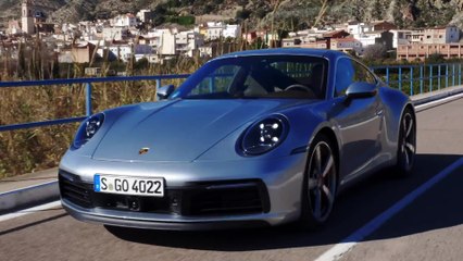 Porsche 911 Carrera S in Silver Metallic Driving in on the Country Road