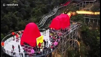 99-metre-long dragon dances on glass bridge to celebrate two world records having been created