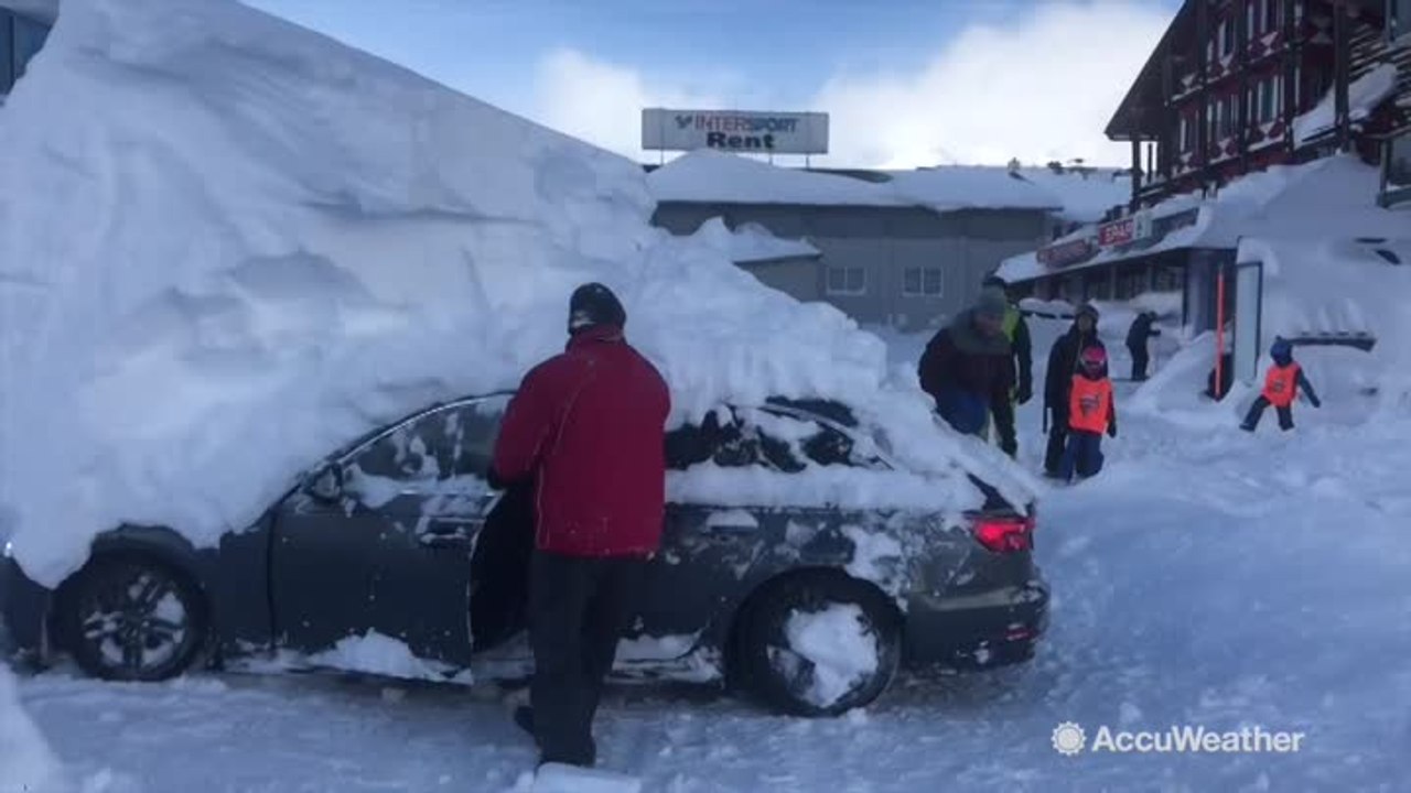 Driver reverses car while under 6ft-high snow mound