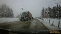 Stalled Semi Carrying Salt Ploughed by Train