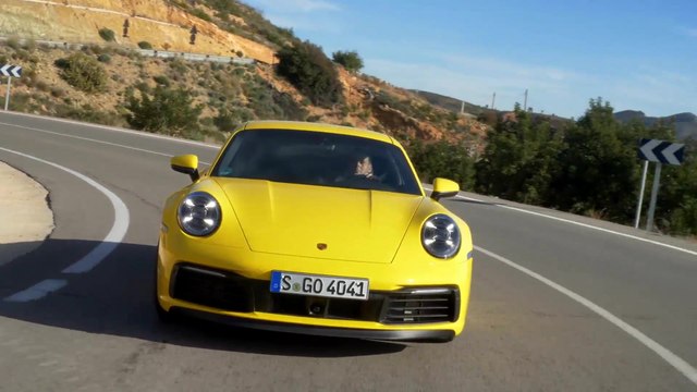 Porsche 911 Carrera 4S in Racing Yellow on the Country Road