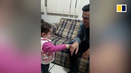 Heartwarming moment a toddler uses sign language to ‘talk’ to deaf dad
