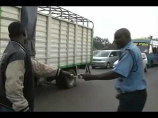 Traffic cop, motorist in highway brawl
