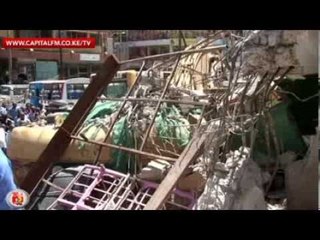 City building caves in ahead of time, injures 3