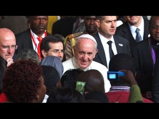 Pope nearly falls as excited worshipper tugs him