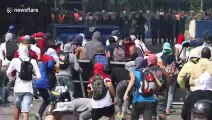 Clashes on the streets of Caracas as Venezuela stages mass protests