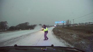 Wisconsin police officer narrowly avoids SUV sliding on icy road