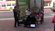 Kids trio  playing violin and bass Market st, San Francisco -1-21-2019