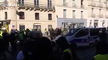 Injured man pulled to safety during yellow vest protests in France