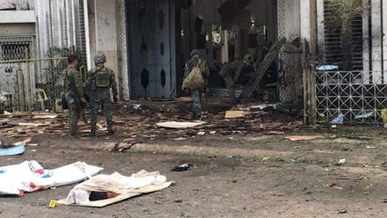 Twin blasts at church kill at least 21 in southern Philippines