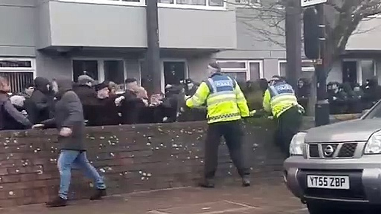 The moment a football fan appears to have his face slashed with a knife