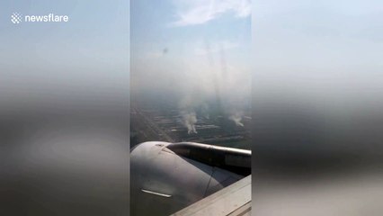 Aerial footage shows Thai farmers burning crops in smog-ravaged Bangkok