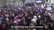 'Red scarf' protesters march against 'yellow vest' violence