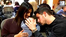 Priyanka Chopra And Nick Jonas Cuddling A Baby Is Making Us Super Emotional