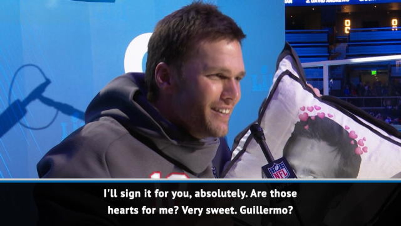 Tom Brady signs pillow with his face on it, hugs talk show star