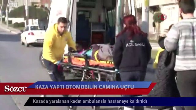 Kaza yapan motosikletteki kadın otomobilin camına uçtu