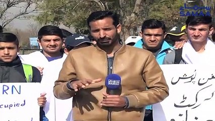 Operation against illegal construction of cricket ground in Islamabad, players protest wearing shrouds