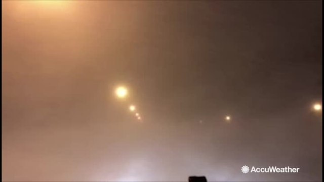 Must see: Snow squall whips across roadway