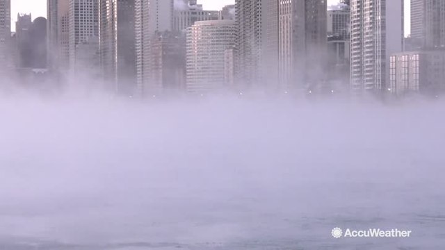 Steam rises off Lake Michigan as temperatures plummet below zero