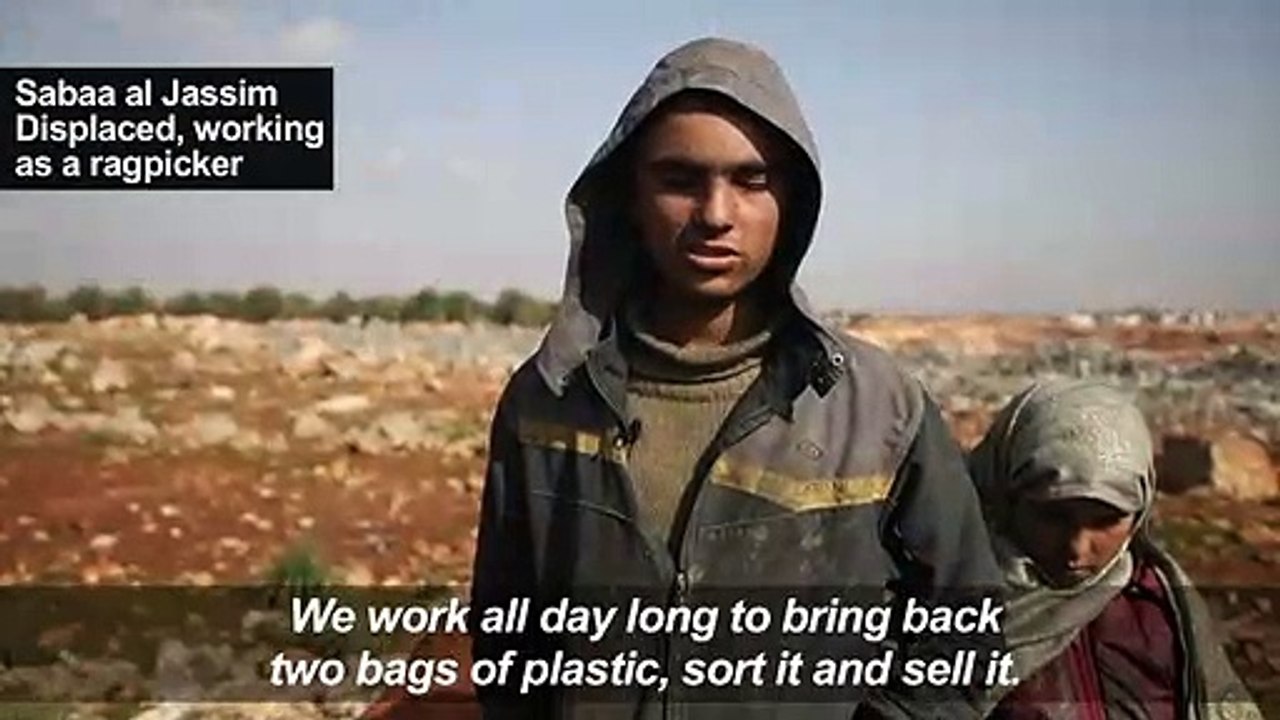 Displaced Syrian children sift through trash to buy bread