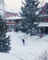 Person Walks Through Town on Skis After Snowstorm