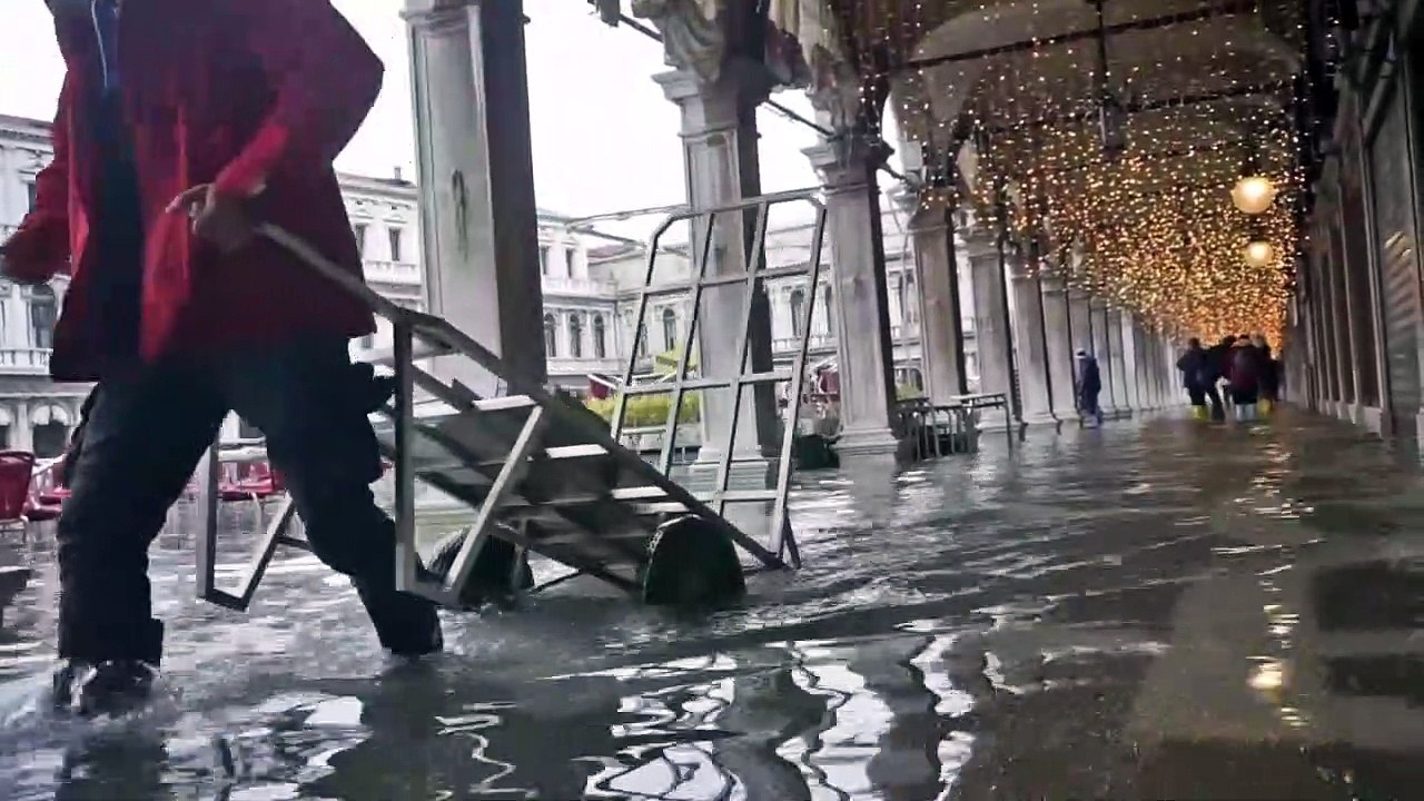 Venice under water as high tide floods historic...