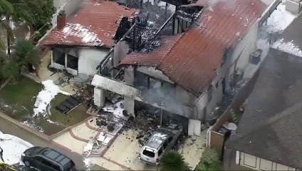 Five killed after plane crashes into house
