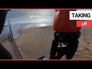 Video shows kite surfer "flying" for 200m over a sand spit | SWNS TV